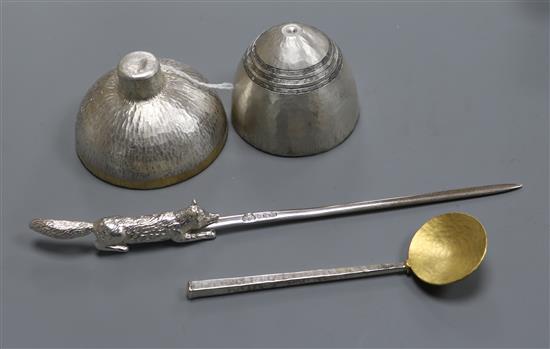 Two modern textured silver-gilt bowls and matching spoon (possibly Sarah Jones) and a letter opener with crouching fox terminal